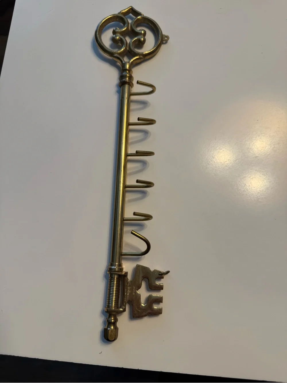 Brass wall hook key holder .